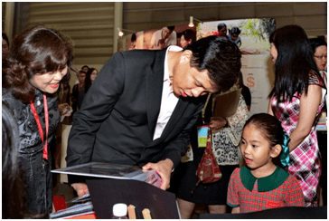 Children from EtonHouse engaging with the Minister of Defence
