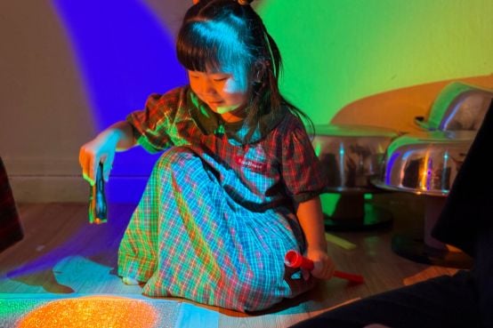 student exploring lights