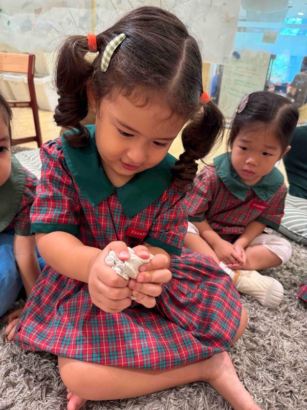 Nursery 1 children exploring clay through touch and movement