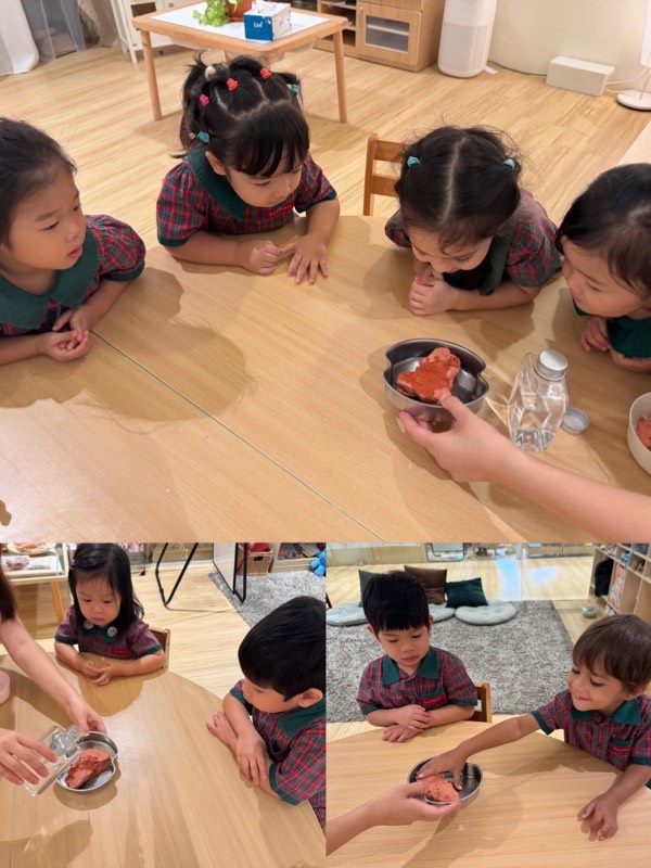 Nursery 1 children observing how water changes clay