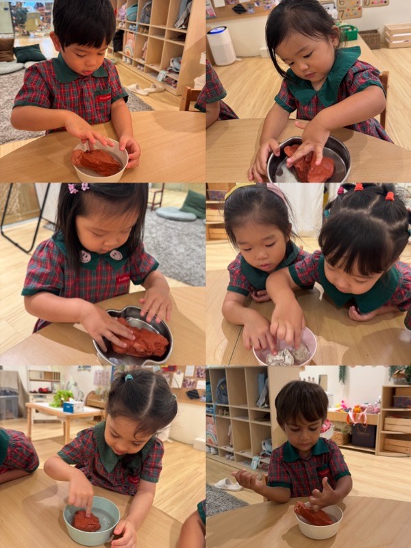Nursery 1 children observing how water changes clay