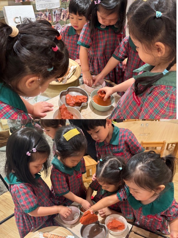 Nursery 1 children observing how water changes clay