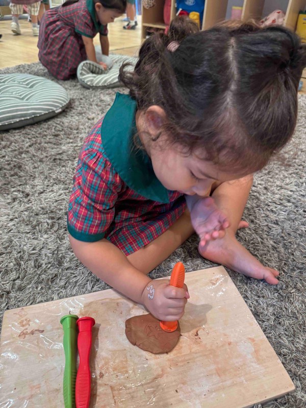 Nursery 1 children discovering textures and patterns with clay