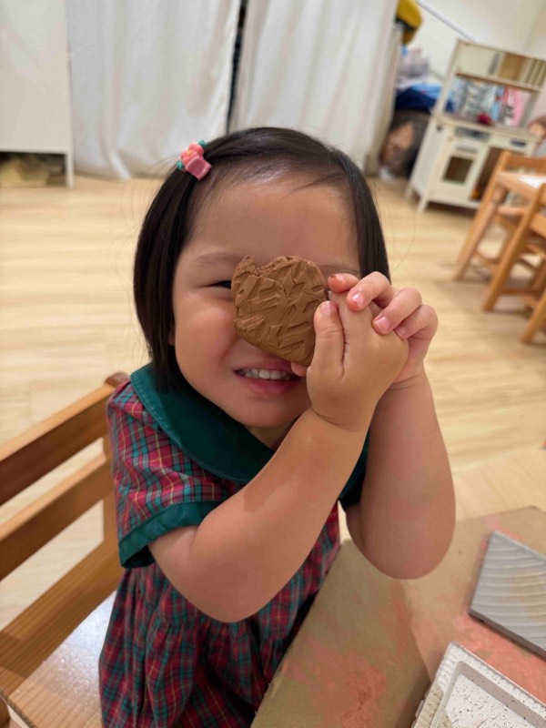 Nursery 1 children discovering textures and patterns with clay