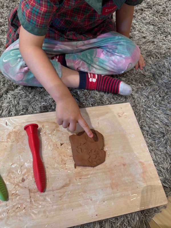 Nursery 1 children discovering textures and patterns with clay