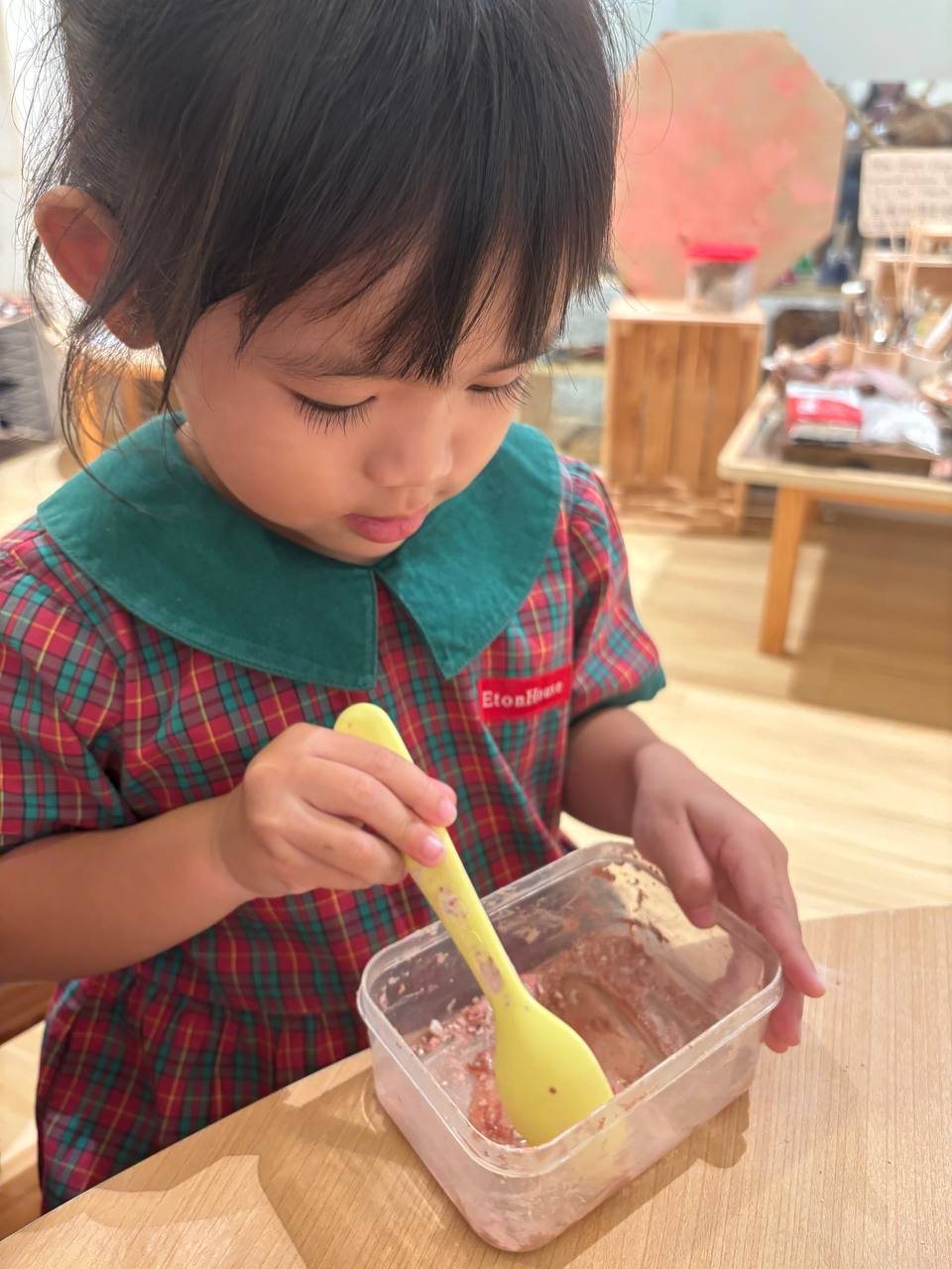 Nursery 1 children mixing clay powder and water