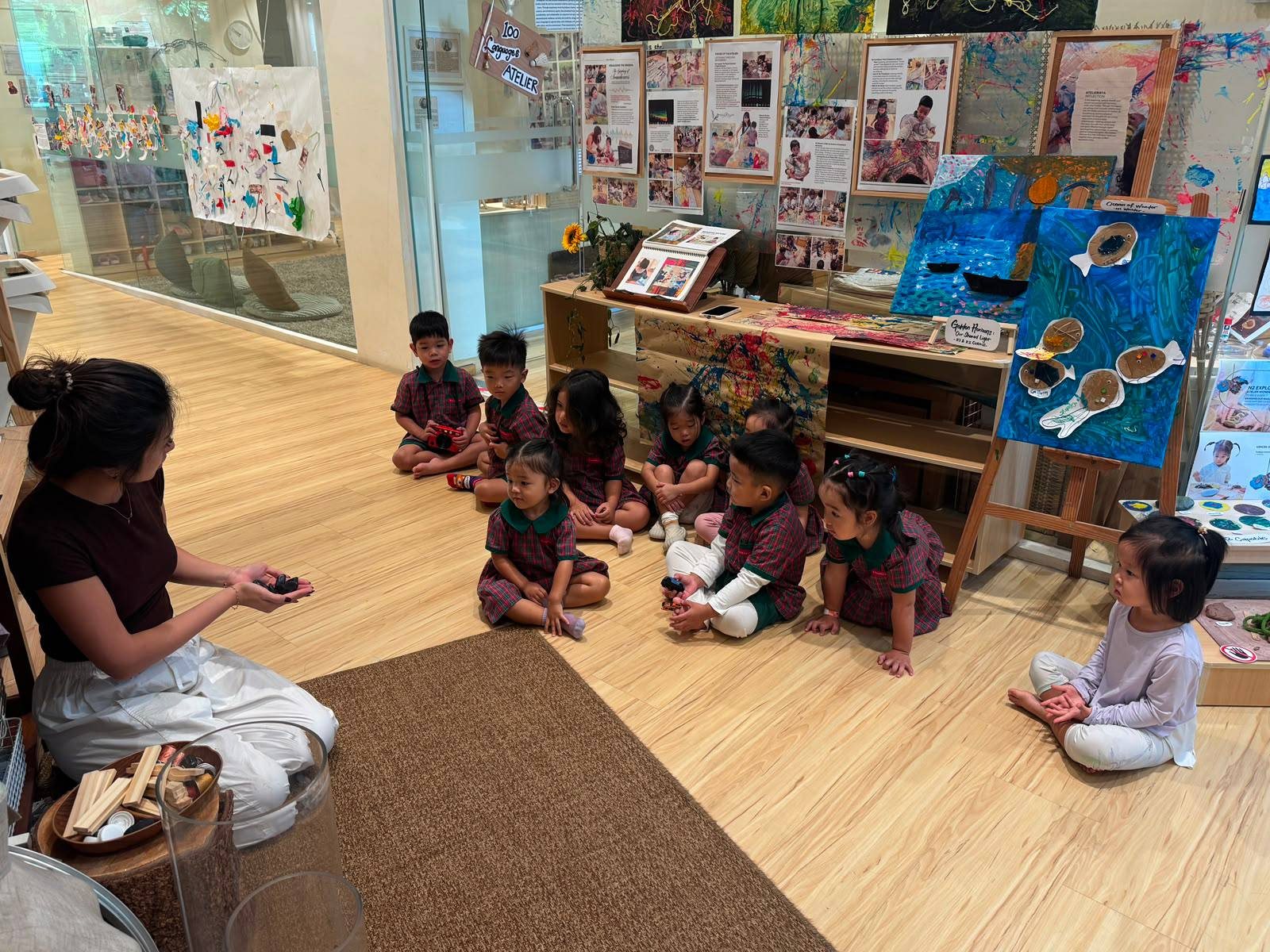 Nursery 1 children selecting loose parts and reusable materials