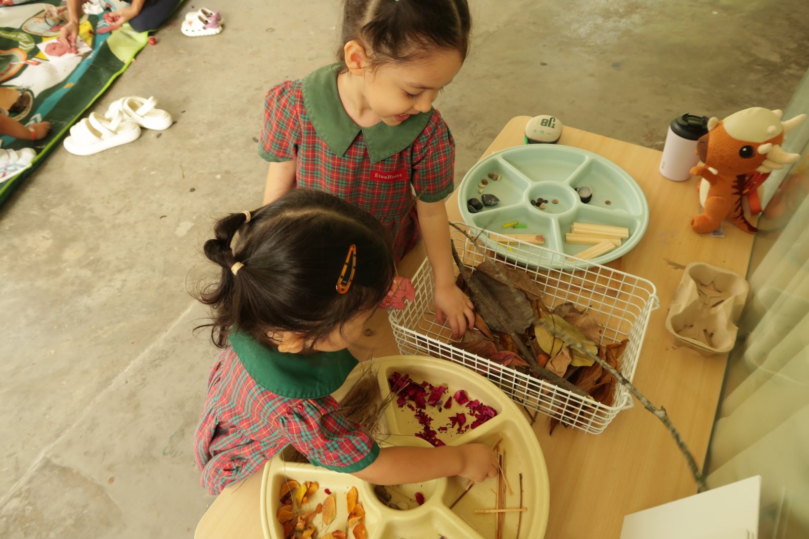 Families creating clay sculptures together