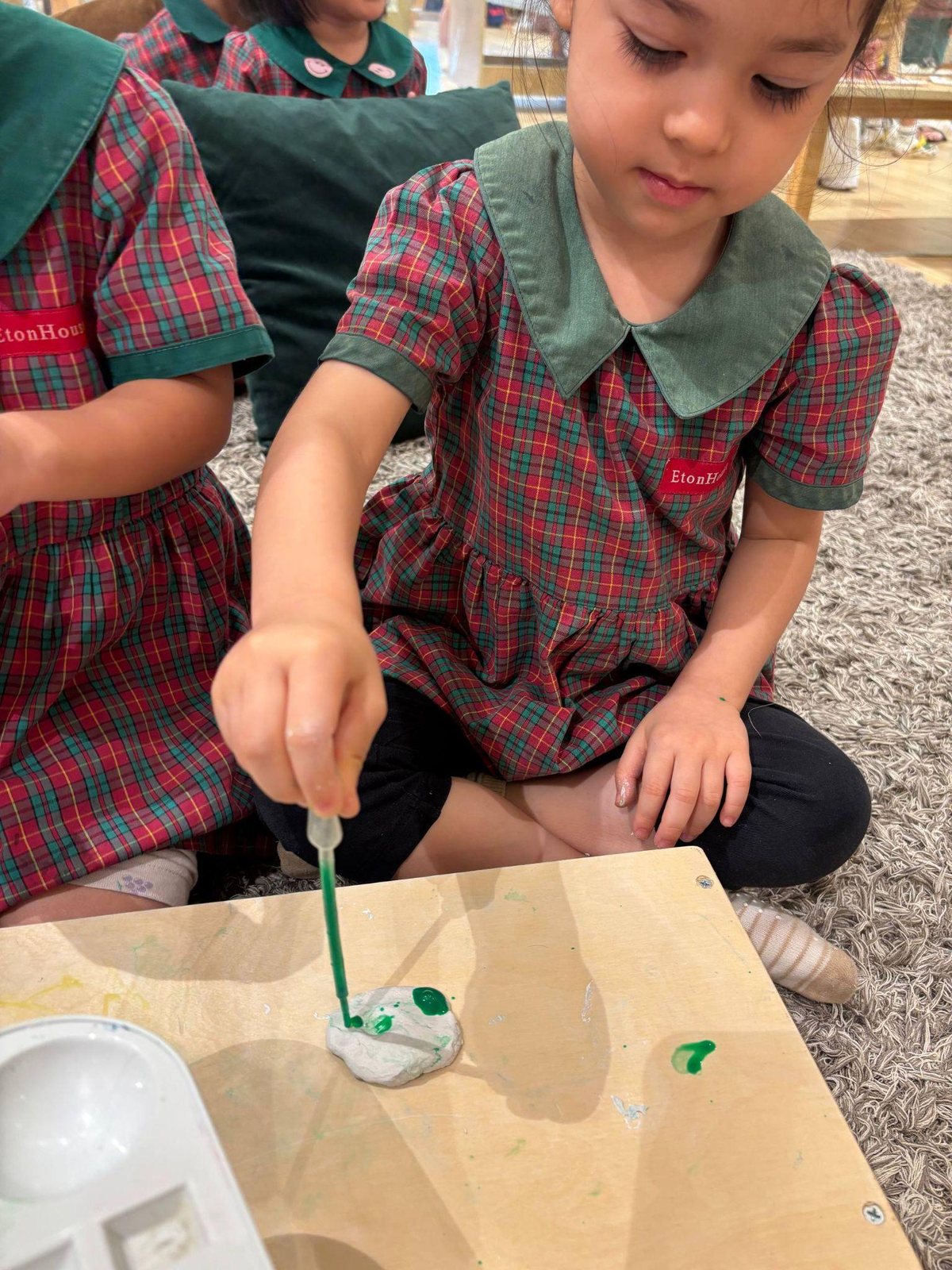 Nursery 1 children combining paint and clay
