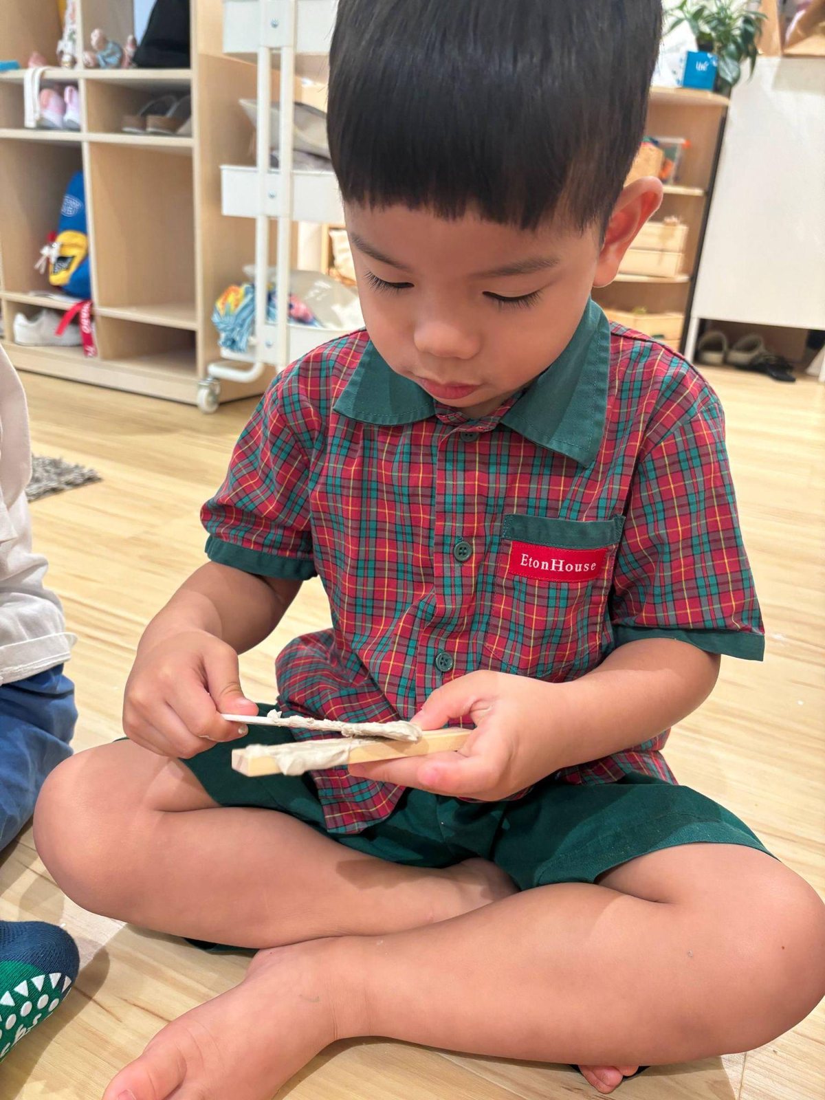 Nursery 1 children using clay slip as a connector