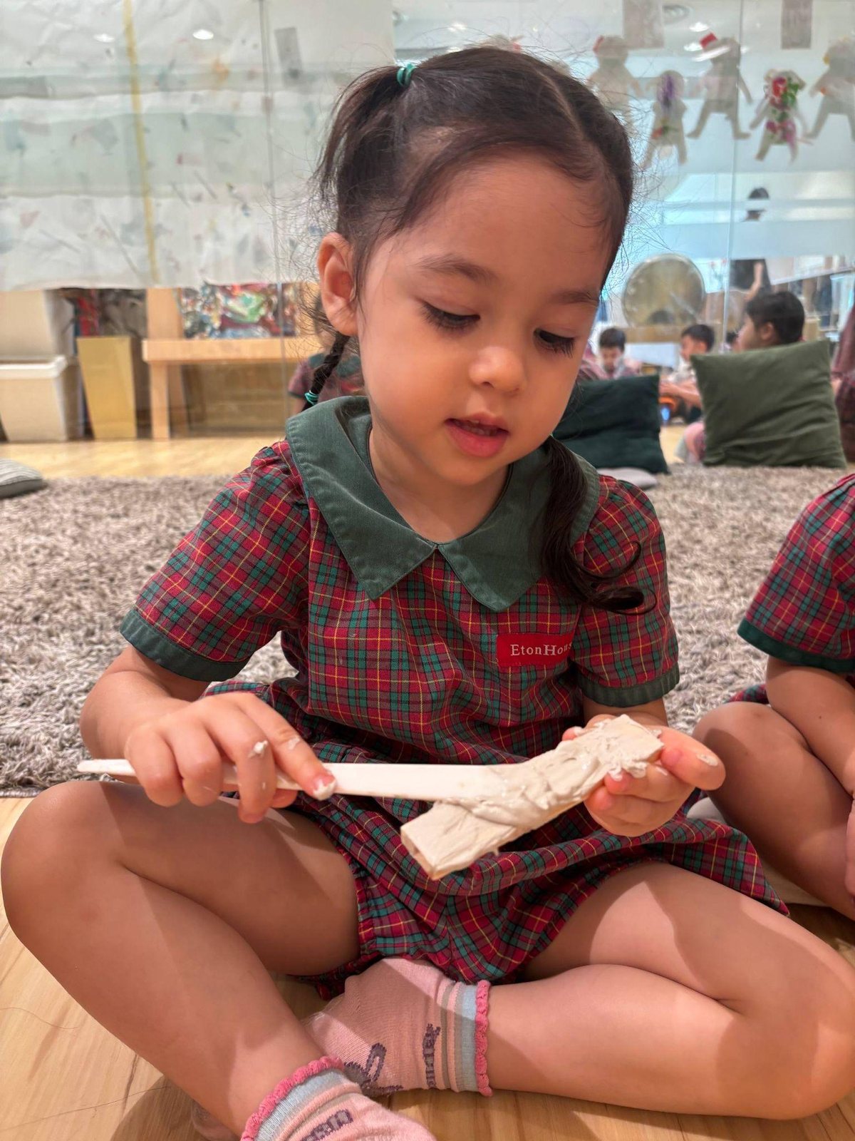 Nursery 1 children using clay slip as a connector