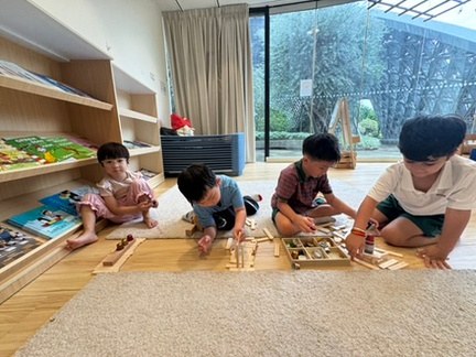 Children creating with wooden loose parts